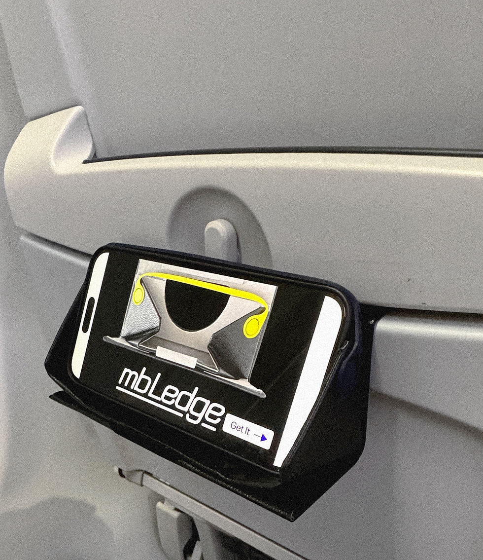 close up of mbLedge attached to plane seat with inset phone