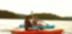 photo of two women kayaking