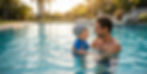 Father holds baby in sunny pool
