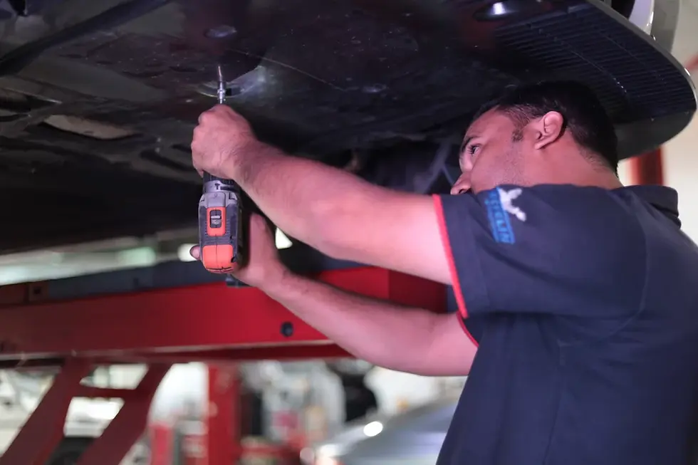 BMW service Dubai technicians from Gran Turismo executing structural mechanical repairs on a premium vehicle in a specialized Dubai repair facility.