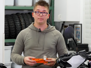 A man holding a tourniquet device