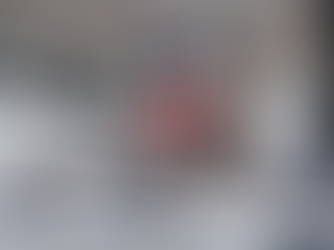 A dirt bike tied down in a trailer 