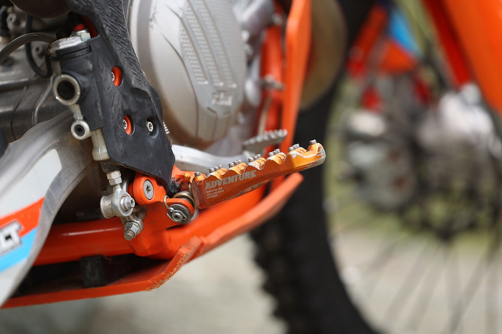 sideview of a motorcycle with footpegs in the foreground