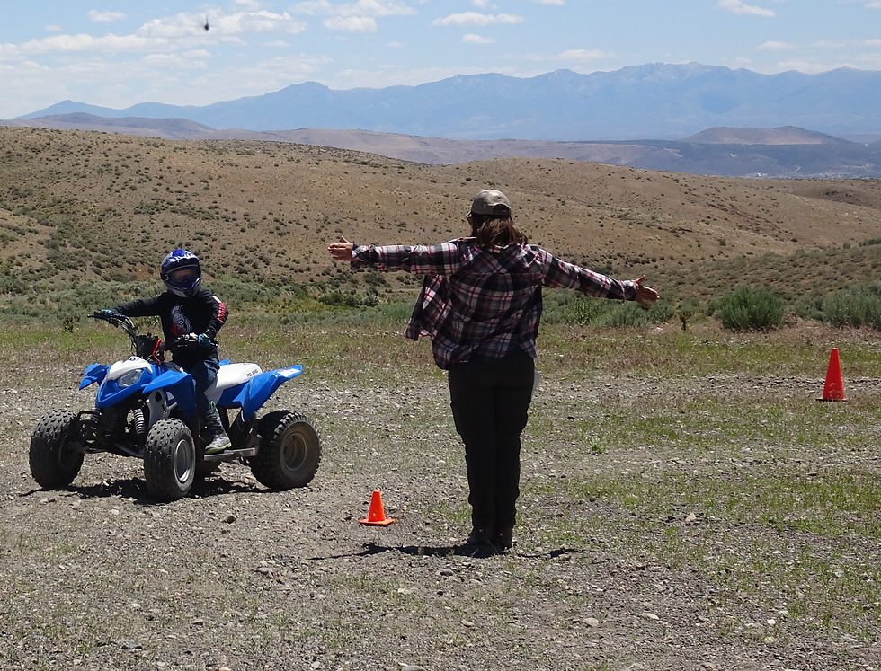 ATV rider and instructor against beautiful Nevada background