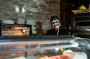 Lively restaurant atmosphere, Halloween season. 