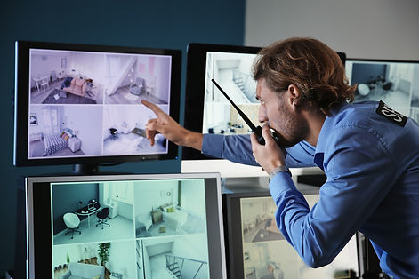 security-guard-monitoring-modern-cctv-cameras-in-surveillance-room.jpg
