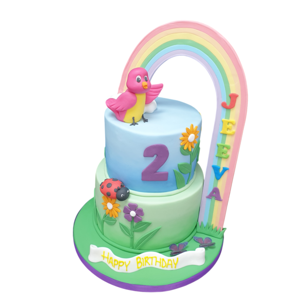Bespoke rainbow-themed celebration cake with colorful layers and decorative accents in Solihull, West Midlands.