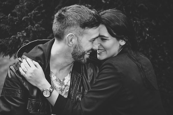 Wedding Photographer Solihull, young couple embracing on an engagement photo shoot, relaxed informal portrait