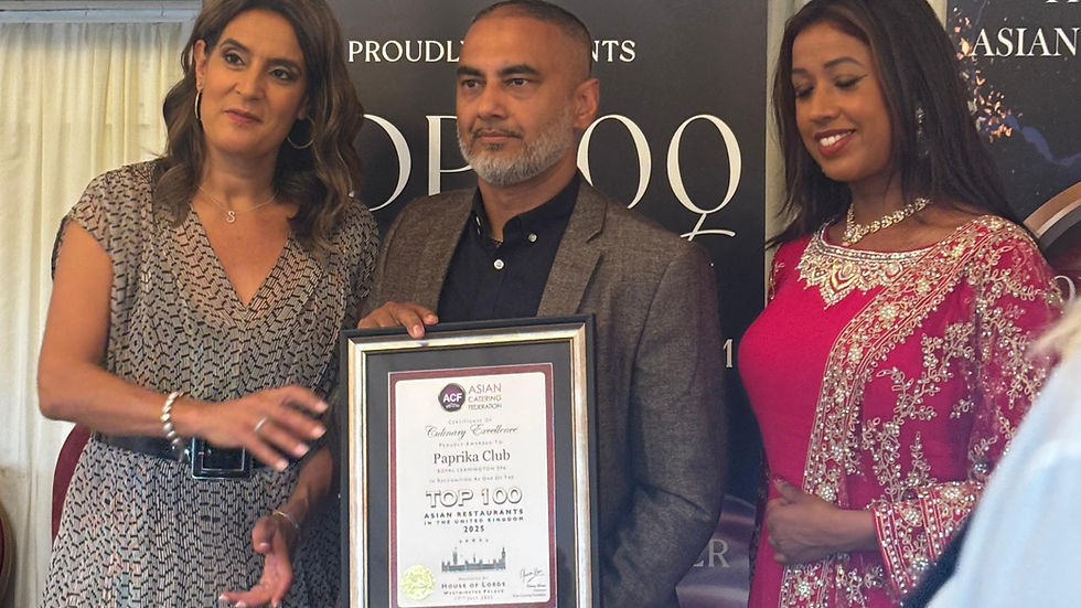 Anisa Khan, right, runner-up on this year's Apprentice, helps present the award to Shamim Uddin