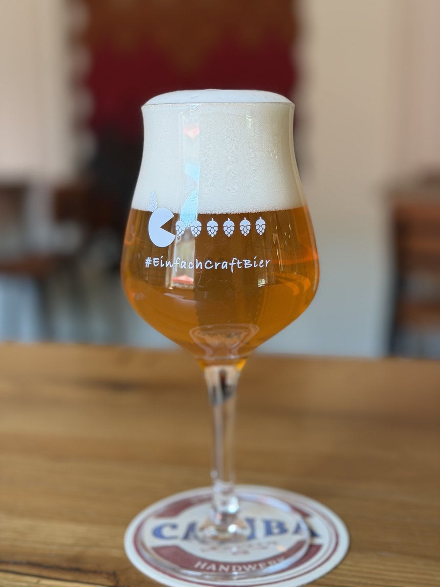 An unfiltered Kellerbier, naturally hazy, in a branded #EinfachCraftBier glass at TapHouse Frankfurt