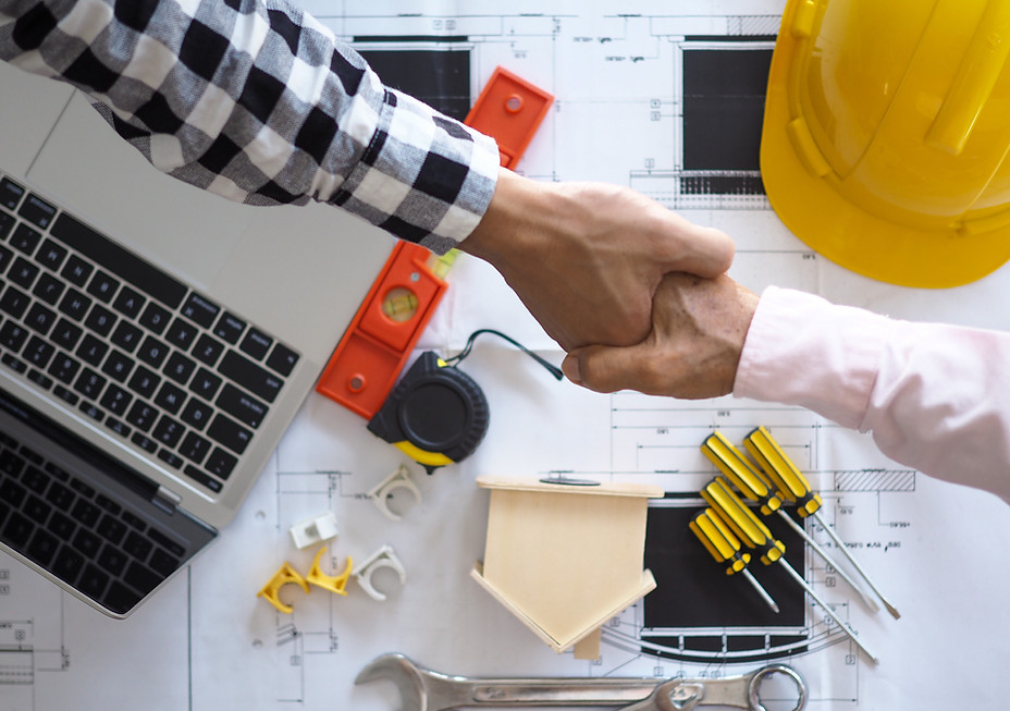 owner and client agreeing on project