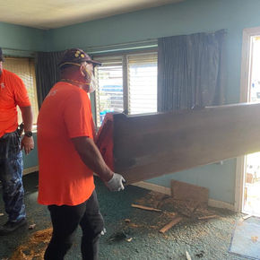 Removing debris in flooded areas in Fort Lauderdale to storm-affected homes