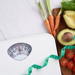 Weight Loss Scale with Centimeters and Fresh Fruits.