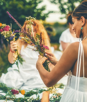 View of women making wreaths with beautiful flowers..jpg
