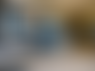 High resolution interior photo of the Novair Dartmouth showroom featuring mounted insulated line sets, a wall mounted Novair display screen, ductless indoor heat pump units in recessed bays, outdoor condenser units on display, and a clean grey and tile flooring layout.