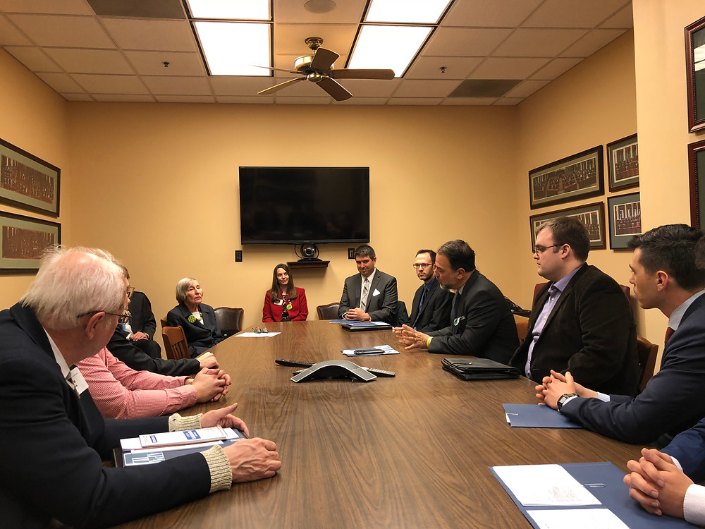people sitting at conference room table