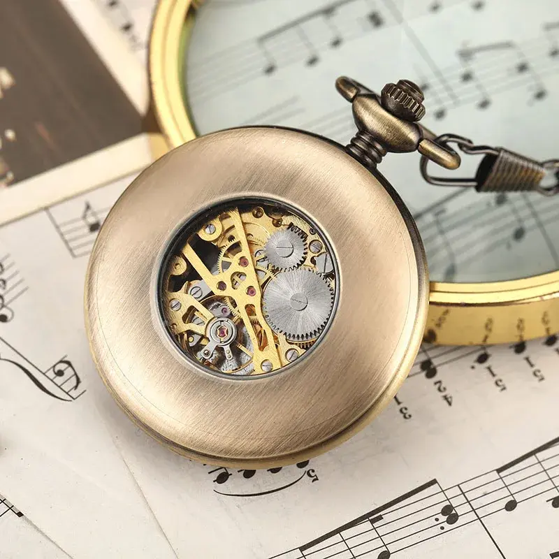 Hollow steampunk mechanical pocket watch on sheet music
