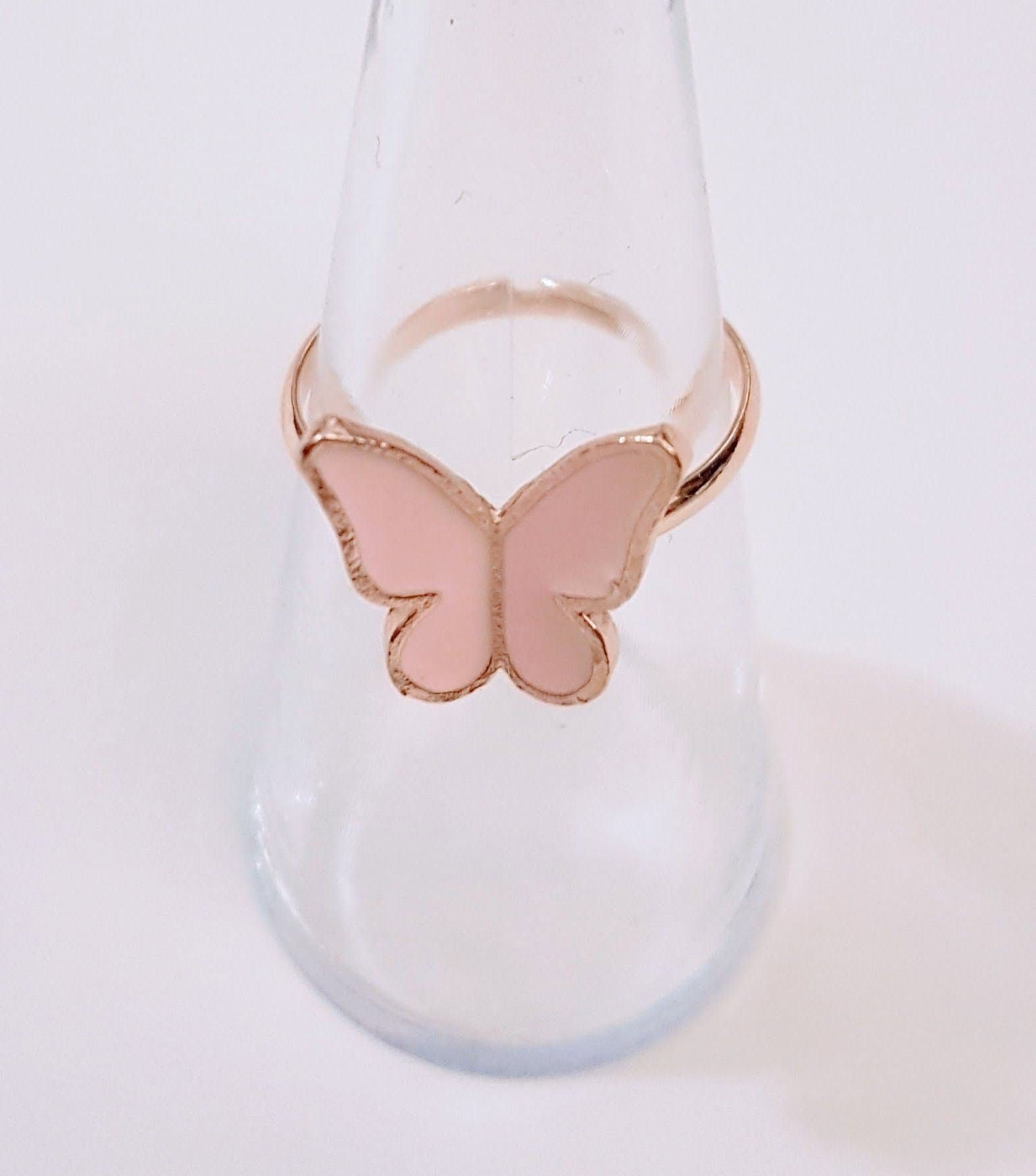 Rose gold ring with a pink butterfly charm