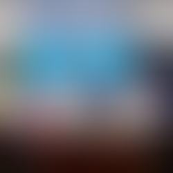 Eight people in a room smiling, holding signed documents for a Memorandum of Agreement. Background screens display colorful text and logos.