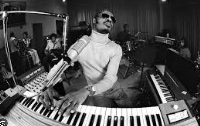 Stevie Wonder creating great music on the piano keys!