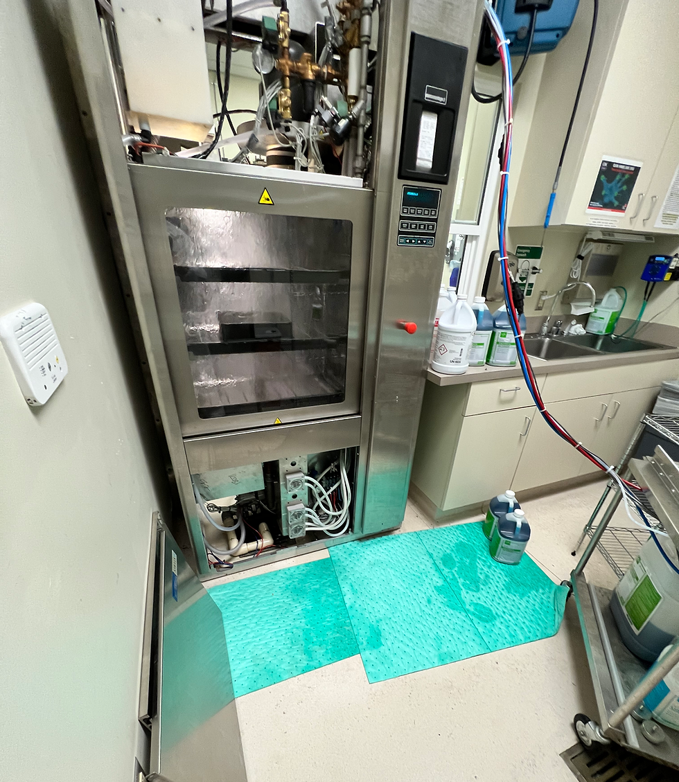 Service technician working on sterile processing equipment