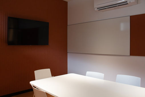 Staff meeting room with L15 porcelain whiteboard and cinnamon acoustic wall panels at Mount Lilydale Mercy College.