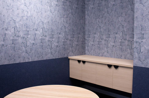 Meeting room featuring indigo, “Yalgu Nightsky” acoustic panels and timber joinery.