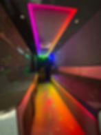 Interior of a GameVan Garage mobile gaming theater with neon LED lighting