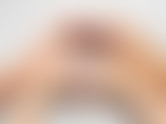 child's hands mimicking adult's hands making a heart shape