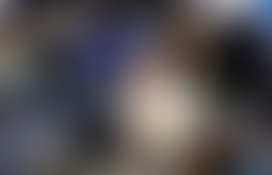 woman looking up from a crowd of people