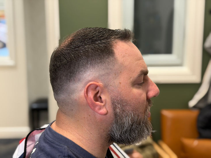 Photo of a mid to high skin fade.