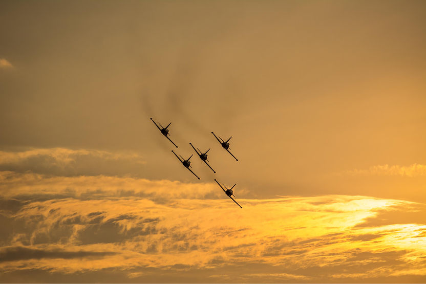 silhouette-airplanes-flying-in-formation-at-sunset-2026-03-24-10-24-37-utc.jpg