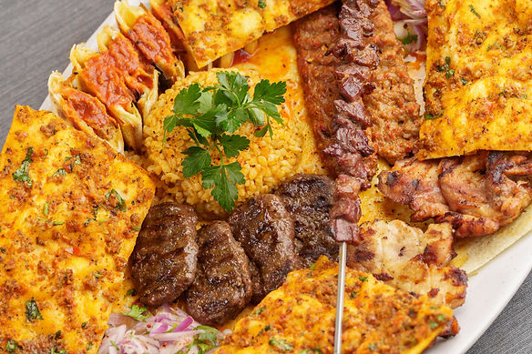 Iskender kebab with yogurt and tomato sauce – traditional Turkish dish, halal certified.jp