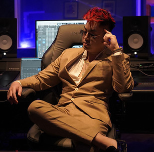 C-Tru Brown suit studio looking away website.jpg