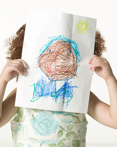 Child Holding Artwork