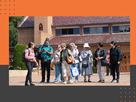 A number of older people chatting and walking together