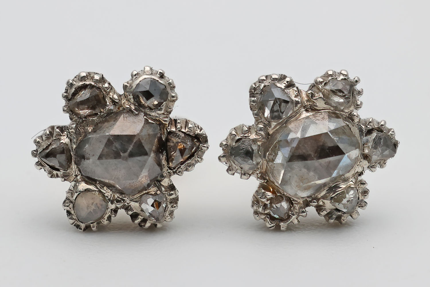 Antique diamond cluster earrings in white gold