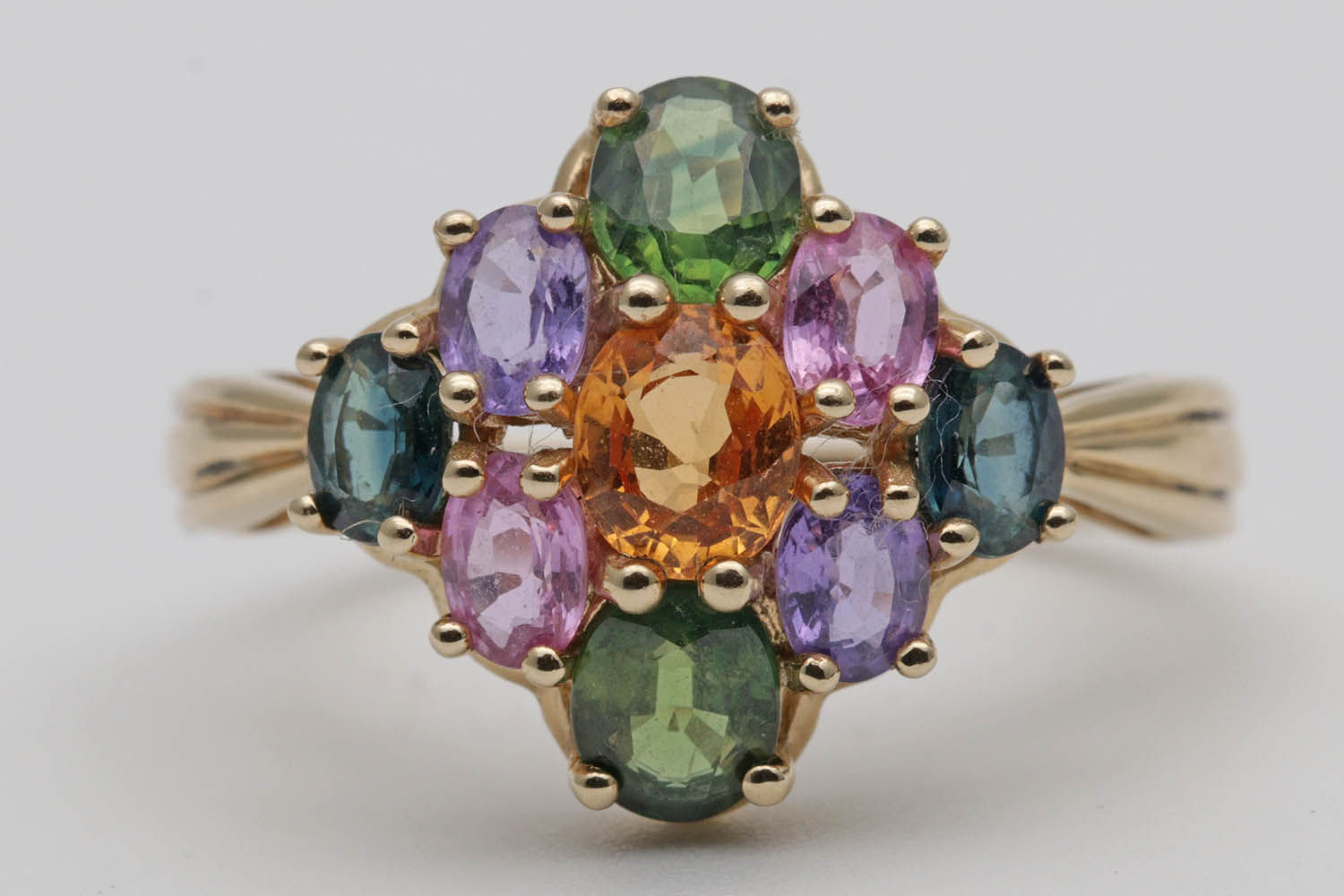 Vari-hue sapphire cluster gold ring