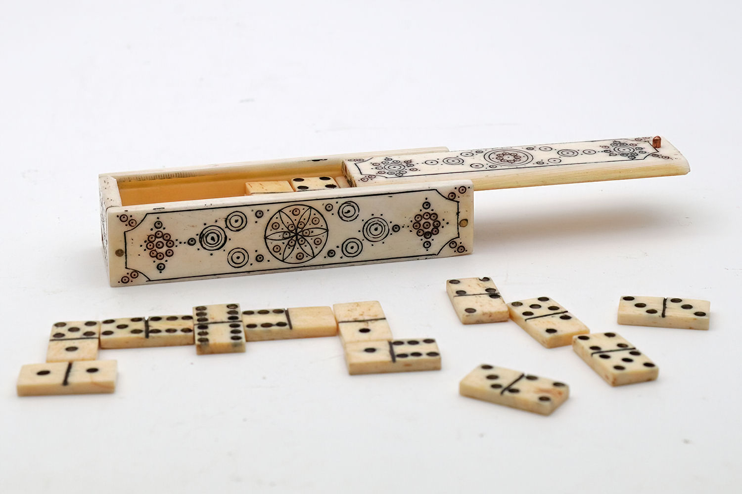 Antique miniature bone dominoes in case