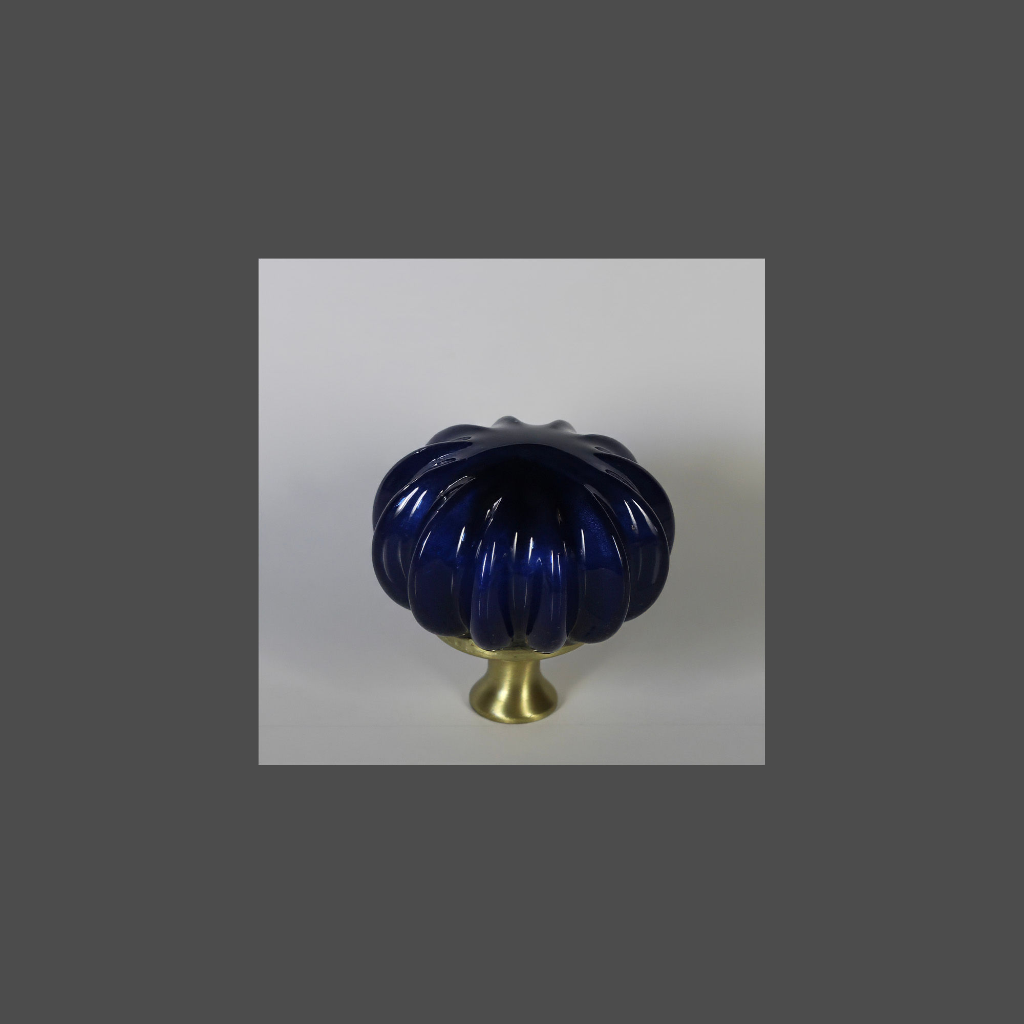 Sea Urchin, color 11, satin brass base knob.