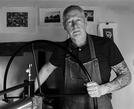 Angus working at the press to create limited edition hand-made prints