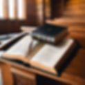 black open bible sitting on a wooden pastor's pulpit .jpg