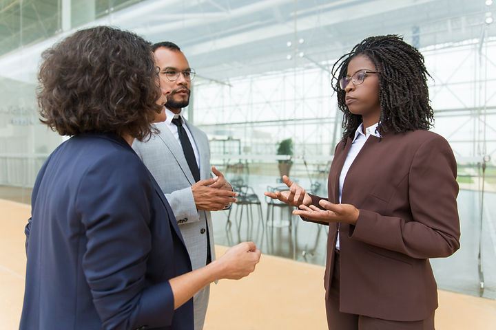 mix-raced-business-team-discussing-project-outside.jpg