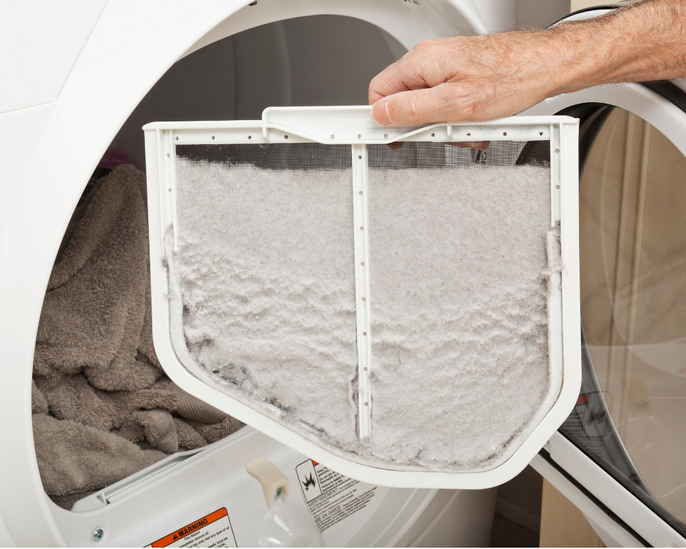 dryer lint trap is full with lint.