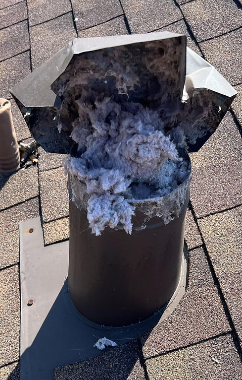 dryer vent pipe coming from the roof is full with cloths lint.