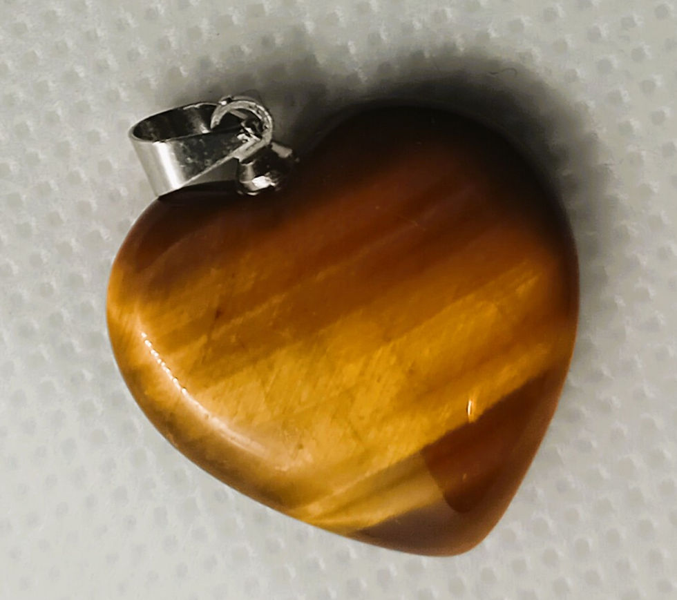 Close-up view of polished tiger's eye stone showing golden and brown bands