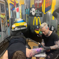 A tattoo session in progress