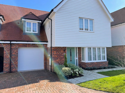 white garage door with house
