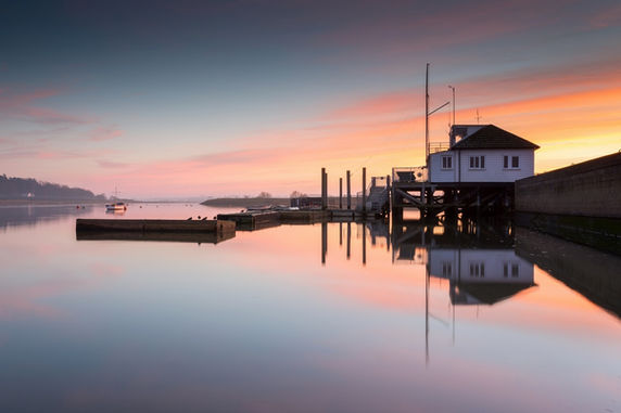 Photo of a Sunset over the sailing club on the River Deben at Woodbridge 