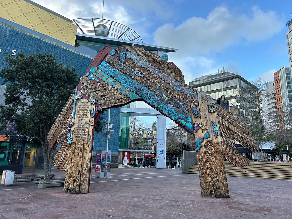 A Maori sculpture representing a gateway stands in Aotea Square.